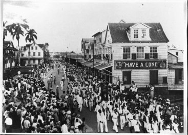 Street with Coca-Cola advertisement.